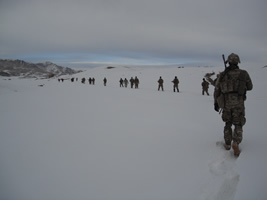 Soldiers walking in the snow in Afghanistan