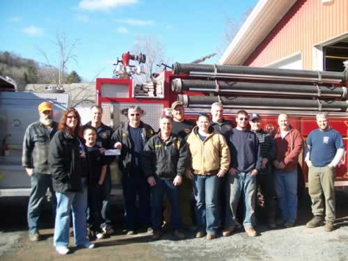 Keeran presenting check to Prattsville Fire Department