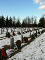 Headstones with wreaths at Saratoga National Cemetery
