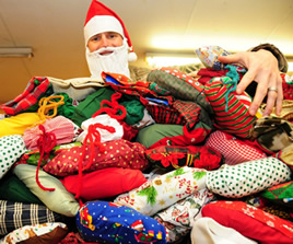 soldier in santa hat with packages